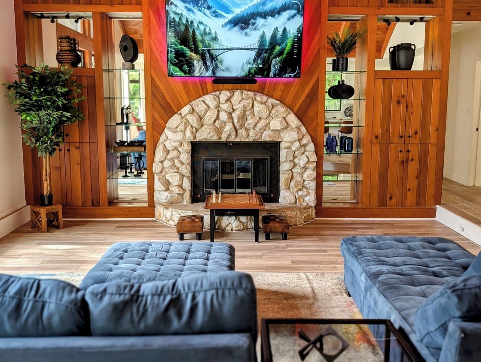Cozy, open-spaced living room with premium Sonos surround sound & fire place. 
