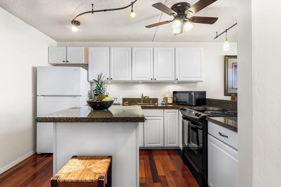 Condo, 1 King Bed with Sofa bed, Lanai, Ocean View (Kona Pacific E630) | Private kitchen | Dining tables