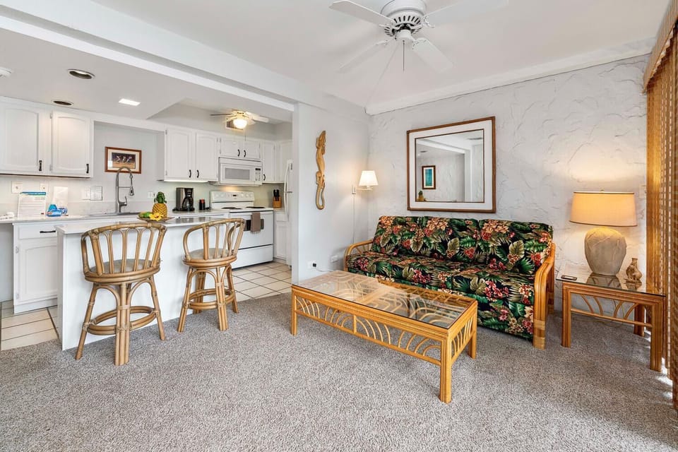 Condo, 1 King Bed with Sofa bed, Lanai, Garden View (Casa de Emdeko 225) | Living area | 42-inch flat-screen TV with digital channels