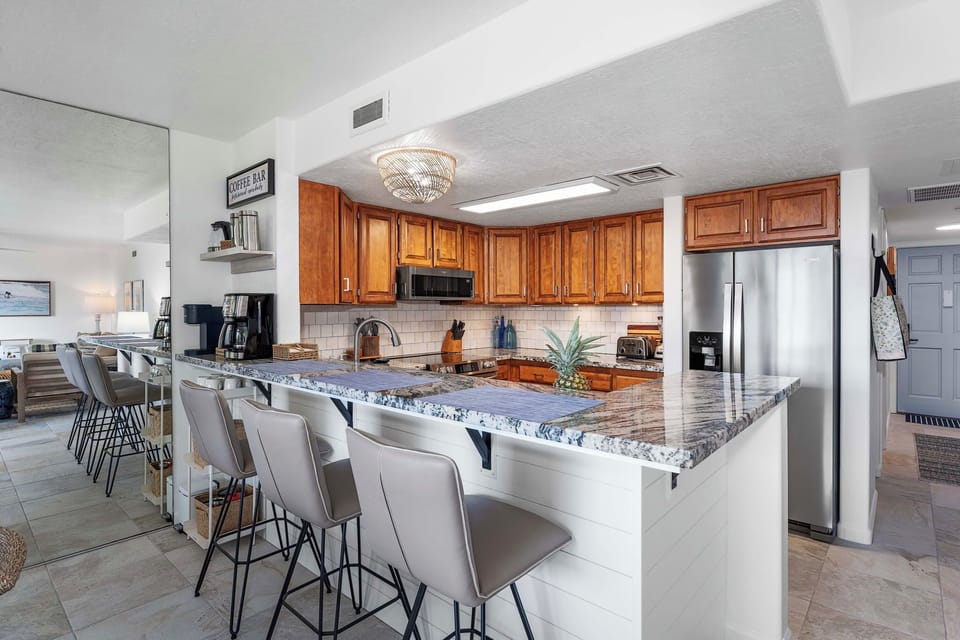 Condo, Multiple Beds, Lanai, Garden View (White Sands Village 127) | Private kitchen | Dining table