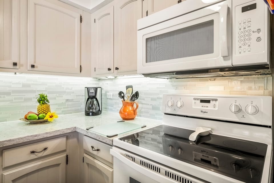 Condo, 1 Queen Bed with Sofa bed, Lanai, Partial Ocean View (Casa de Emdeko 310) | Private kitchen | Dining tables