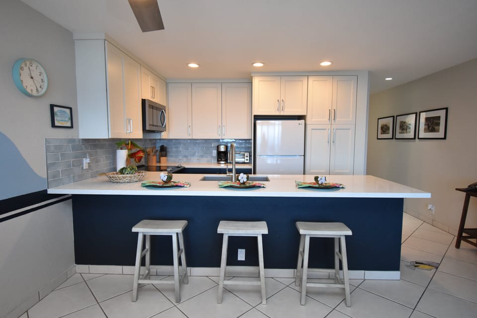 Condo, 1 King Bed with Sofa bed, Lanai, Ocean View (Sea Village 4104) | Private kitchen | Coffee/tea maker, dining tables