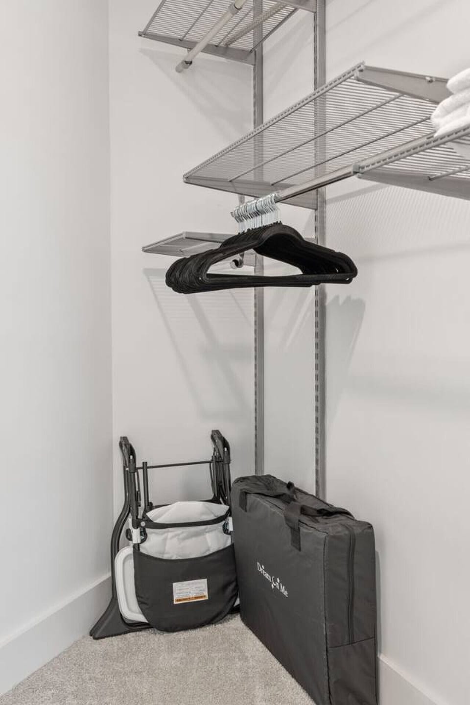 Walk-in closet detail with adjustable shelving, hanging space, and extra storage.