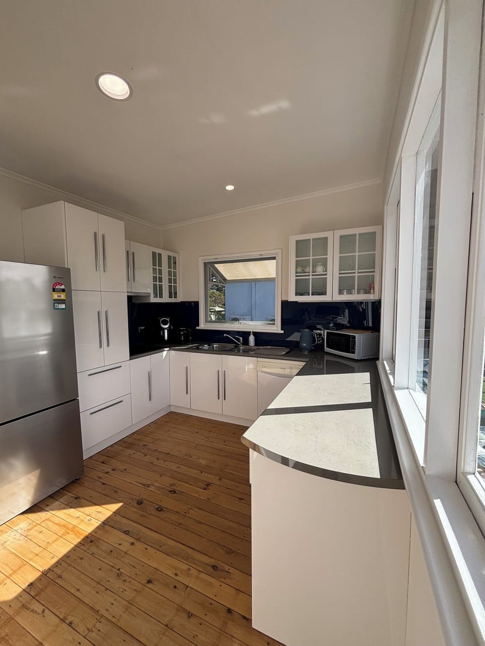 Comfort Townhome | Private kitchen | Full-size fridge, microwave, oven, stovetop