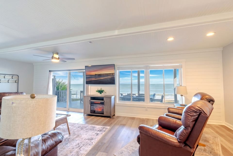 Relax in comfort with direct beach access and Atlantic views from every angle. Cozy fireplace for cooler evenings and plenty of space to unwind after a day on the sand. Pure coastal living.