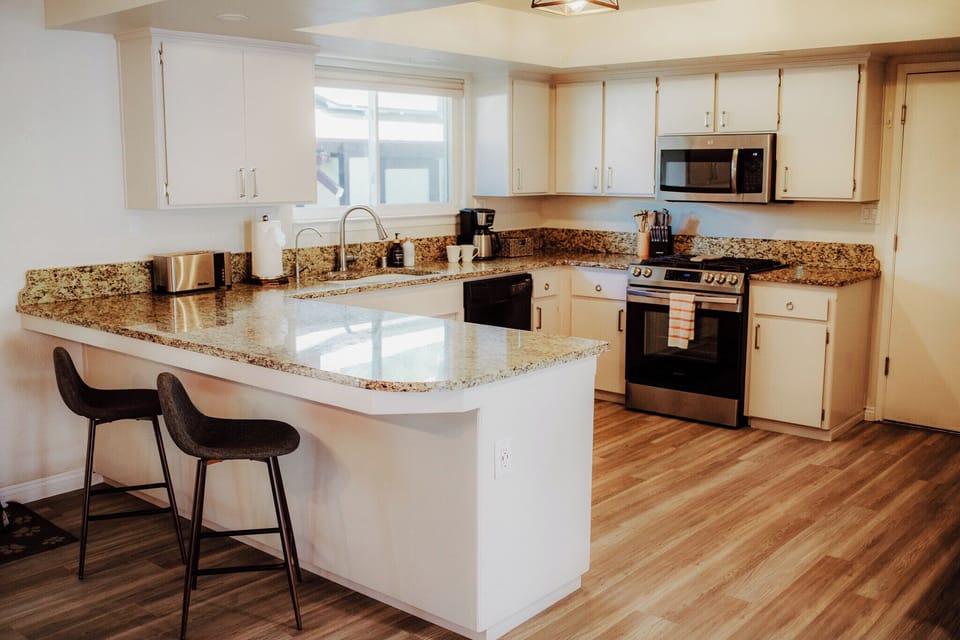 Bright, fully equipped kitchen with modern finishes.