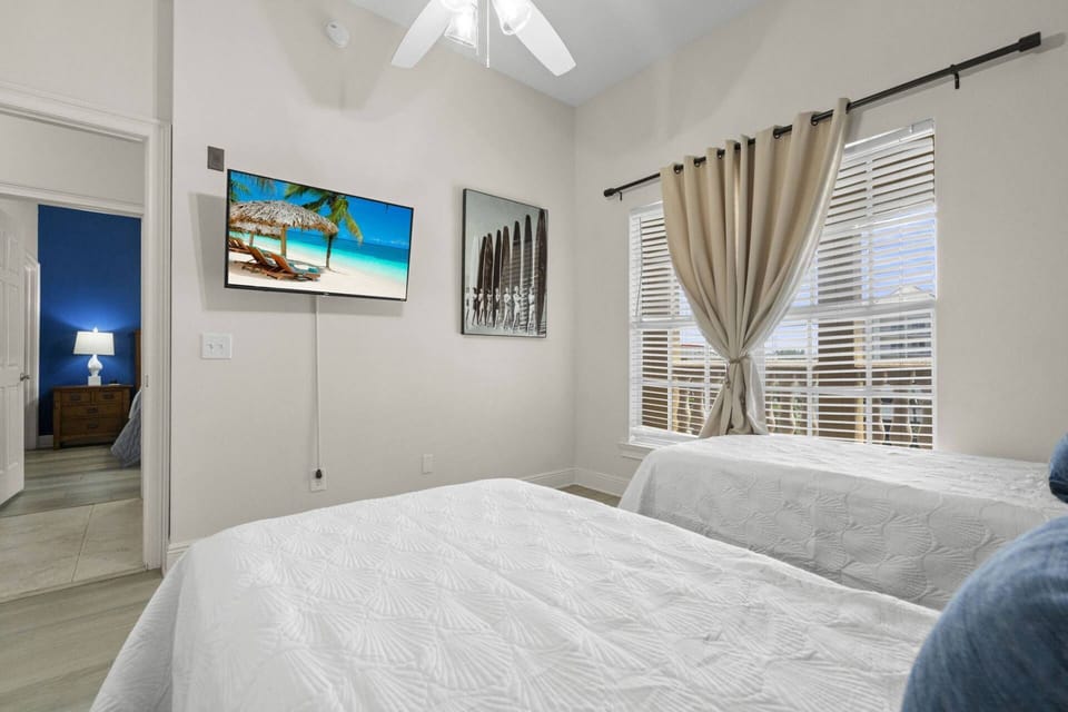 Guest Bedroom with Two Twin Beds and Smart TV