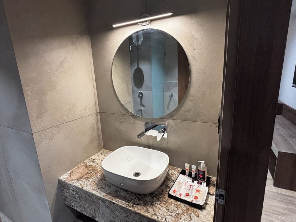Shower, free toiletries, hair dryer, slippers