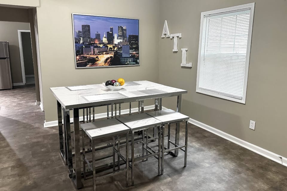 This space doubles as a dining/work area. Tables have outlets for computer and phones.
