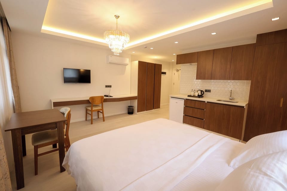 Comfort Double Room, City View | In-room safe, desk, laptop workspace, blackout drapes