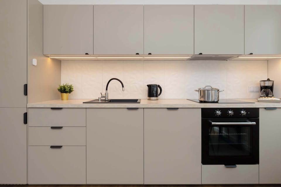 The built-in kitchen with an oven and stovetop makes cooking your favorite meals easy.

