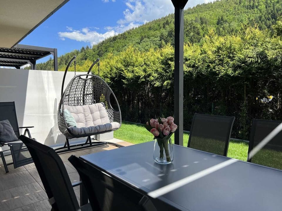 Terrace equipped with comfortable garden furniture.