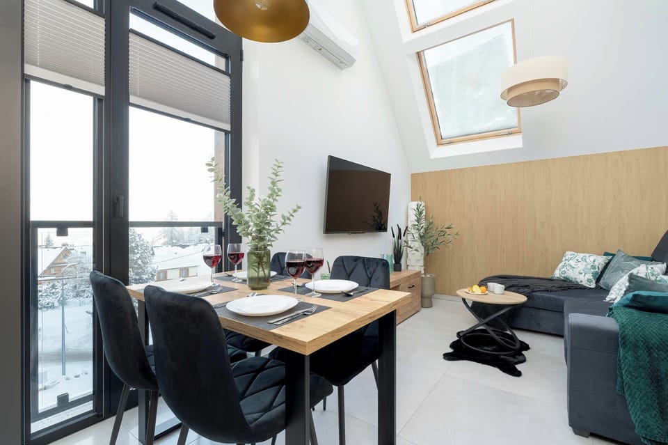 Large table with chairs for eating communal meals. 