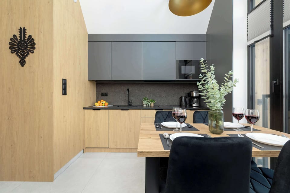 Kitchenette with dishwasher and refrigerator. 