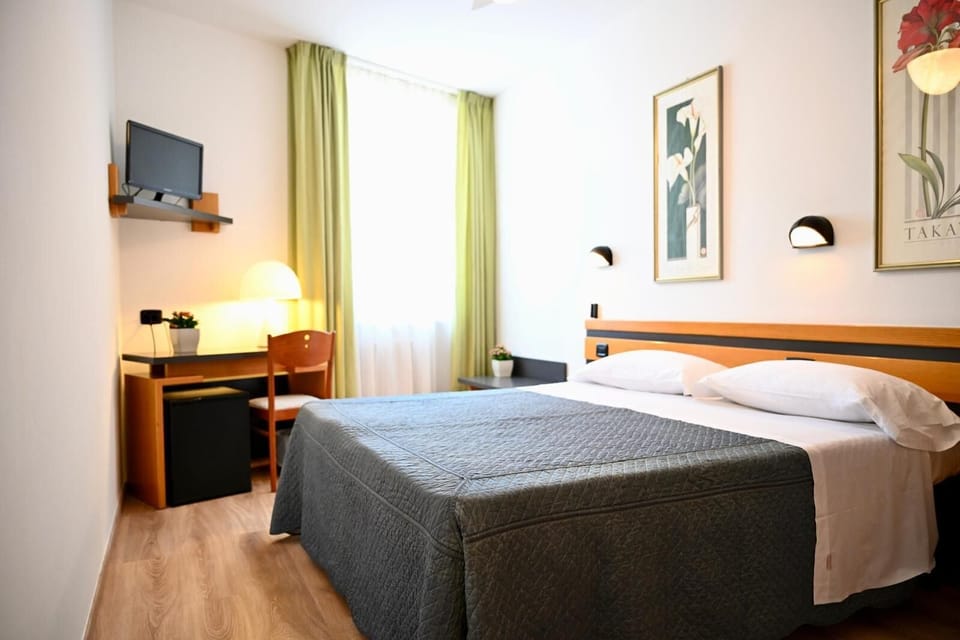 Deluxe Quadruple Room, City View | Desk, free WiFi, bed sheets