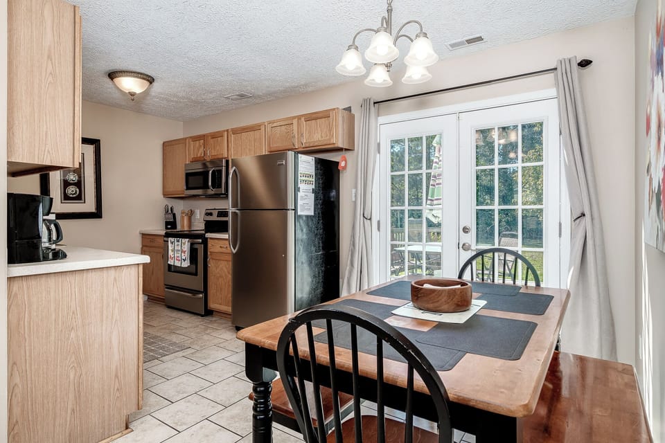 Fully equipped dine-in kitchen including drip coffee maker and Keurig.