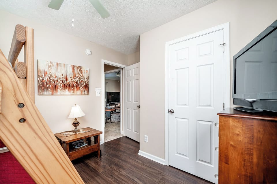 Bunk bed room with twin over full bed and smart TV.