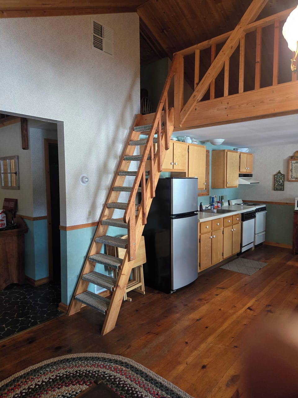 Ladder type stairs to loft.  Must go down facing loft.
