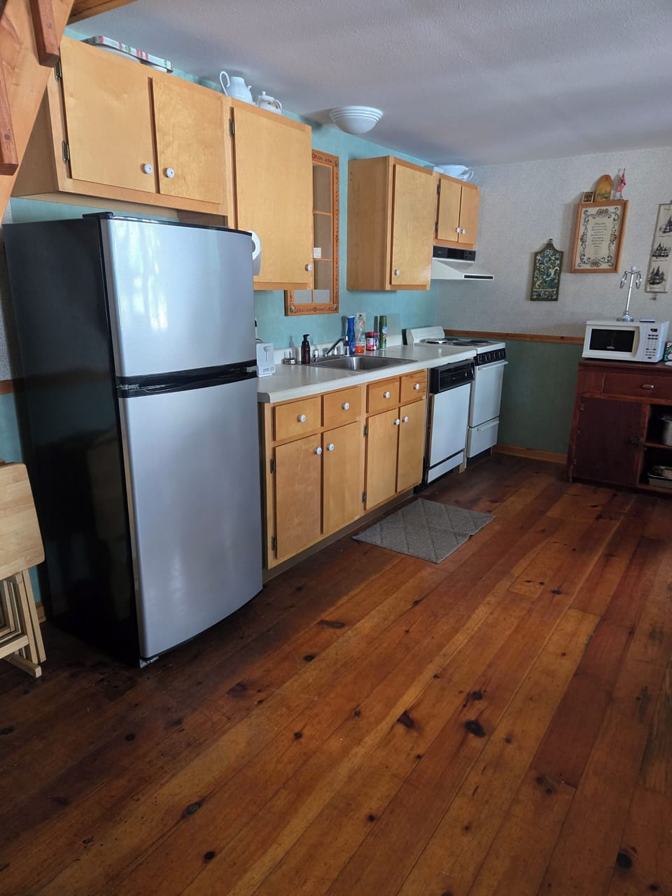 Kitchen with electric range and dishwasher.