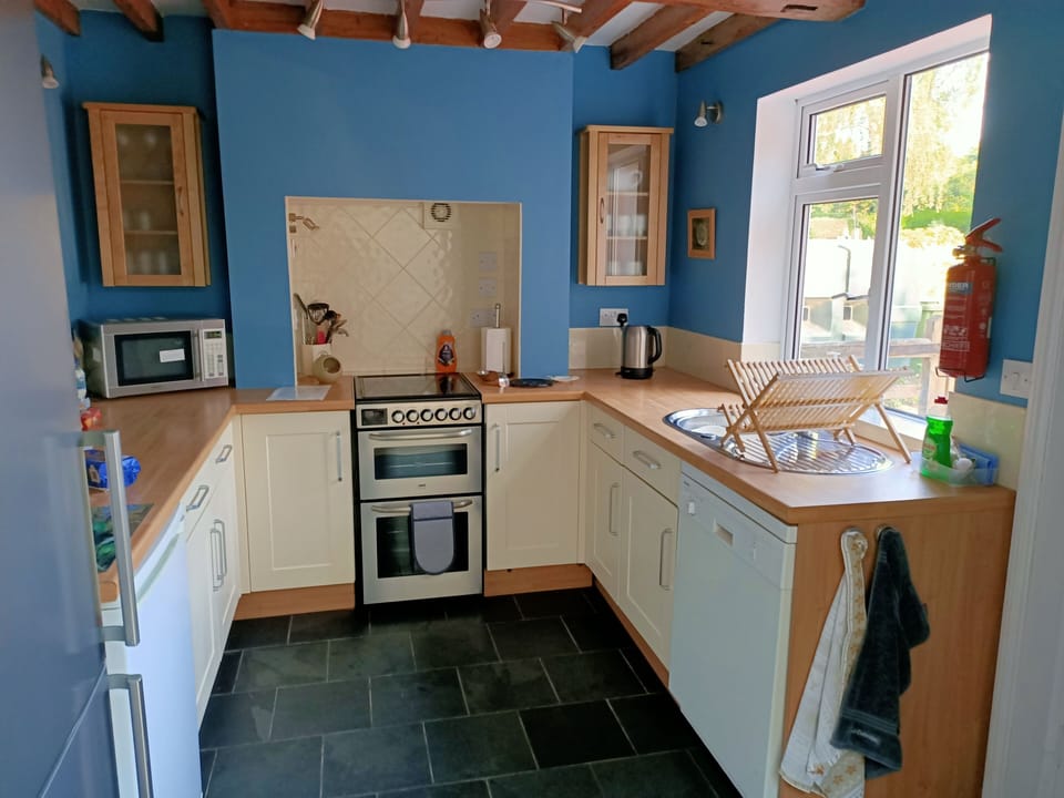 Kitchen with dishwasher, fridge/freezer