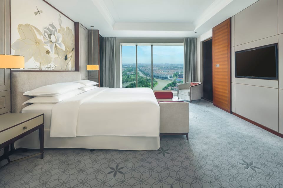 Junior Suite, 1 King Bed | Premium bedding, in-room safe, desk, blackout drapes