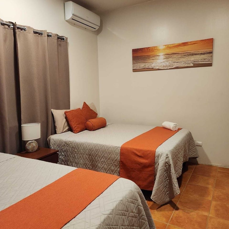 Comfort Quadruple Room, 2 Queen Beds, Patio | Individually decorated, individually furnished, blackout drapes