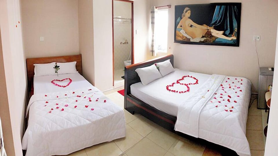 Standard Triple Room, City View | Desk, blackout drapes, soundproofing, free WiFi