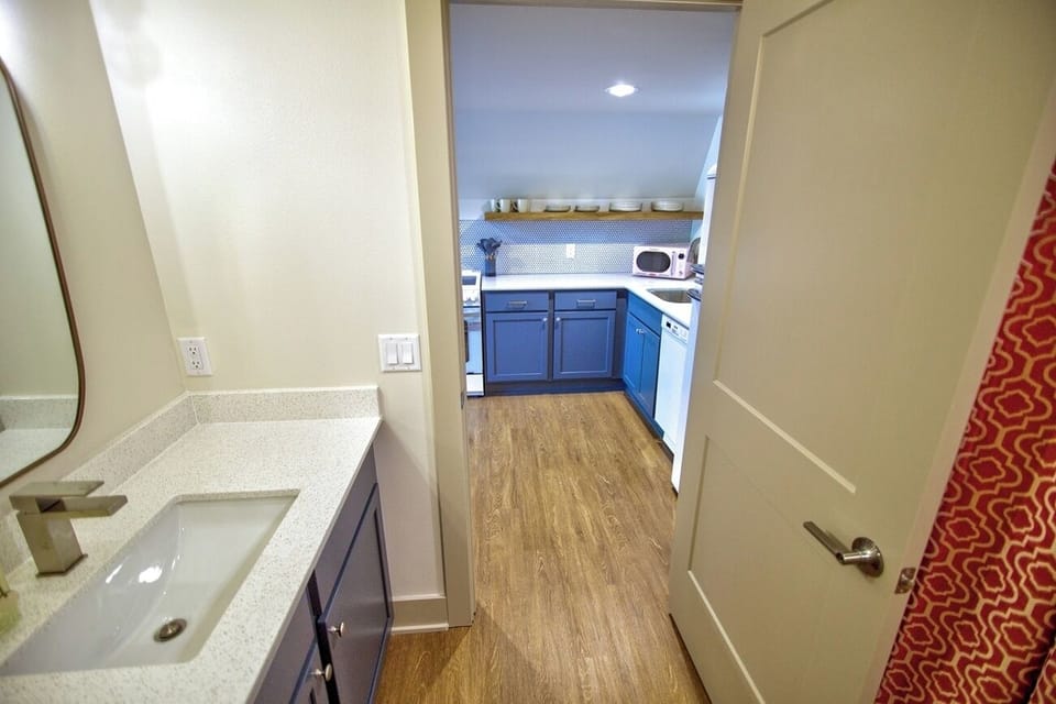 Step out of the shower to a calm, tidy hallway.