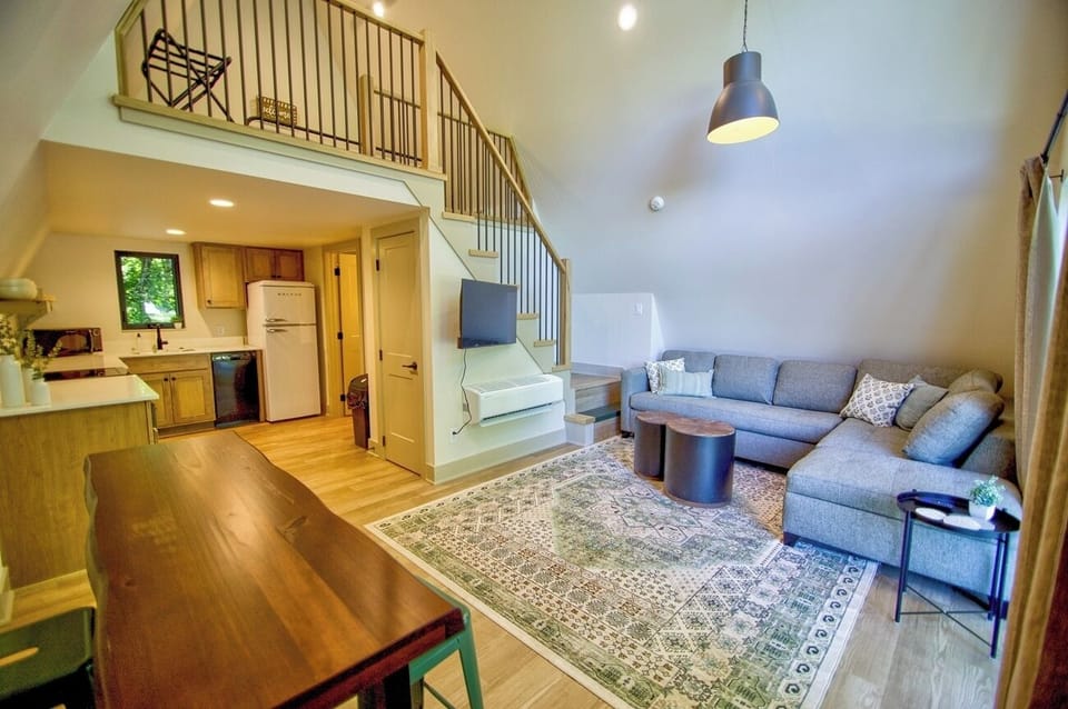 Gather together in the airy great room with open kitchen.