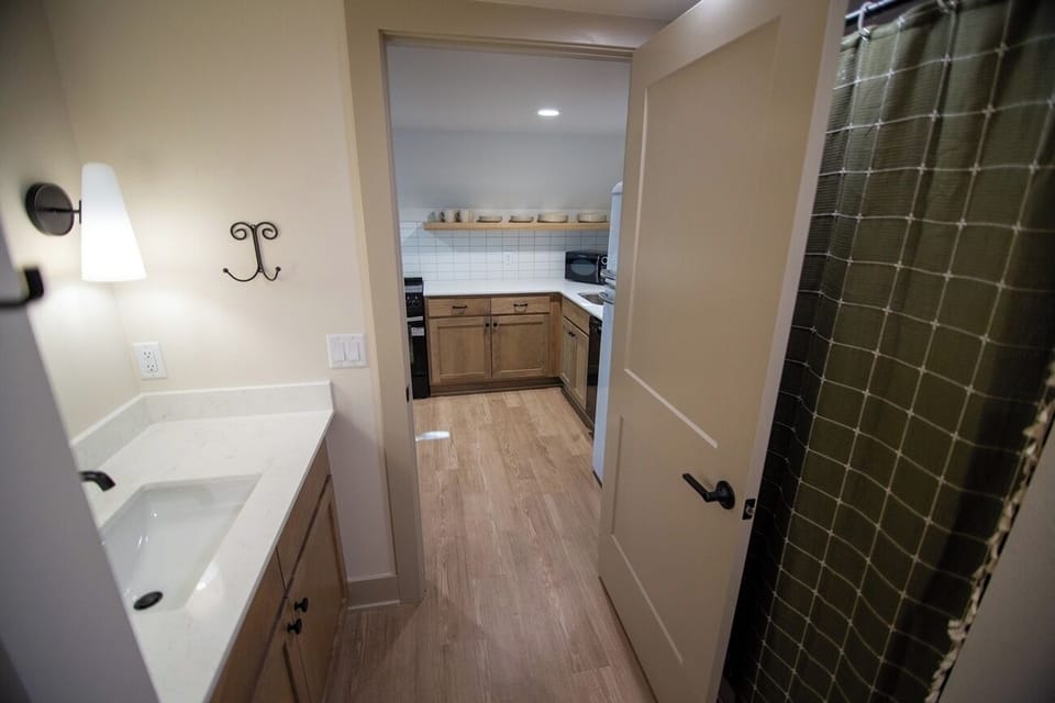 Step into a clean, convenient bath just off the main area.