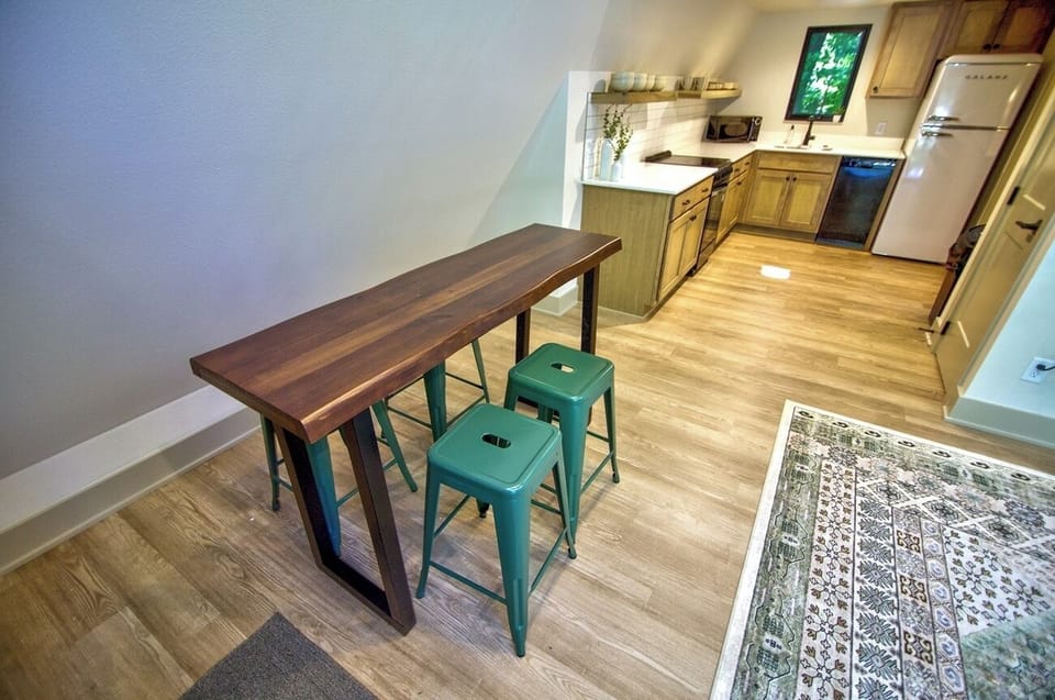 Enjoy casual meals at the modern table steps from the kitchen.