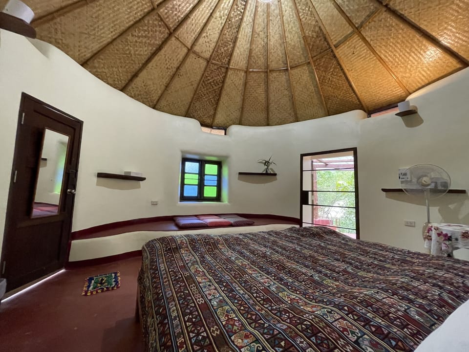 Round House ( Bamboo Room ) | Down comforters, memory foam beds, individually decorated, free WiFi
