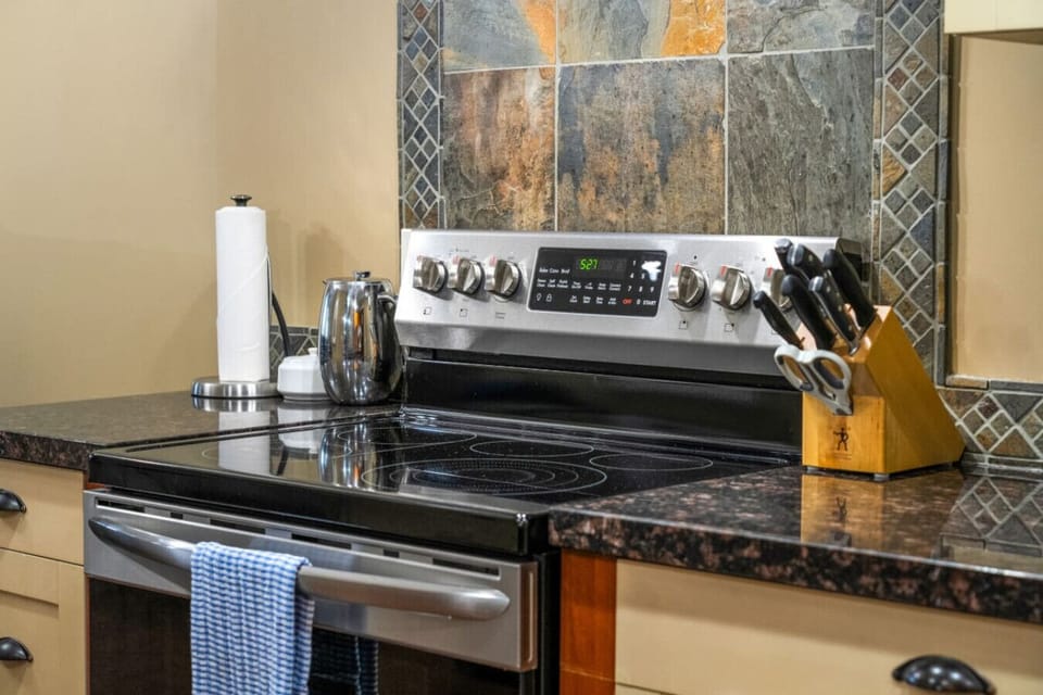 The kitchen is equipped with modern stainless steel appliances.