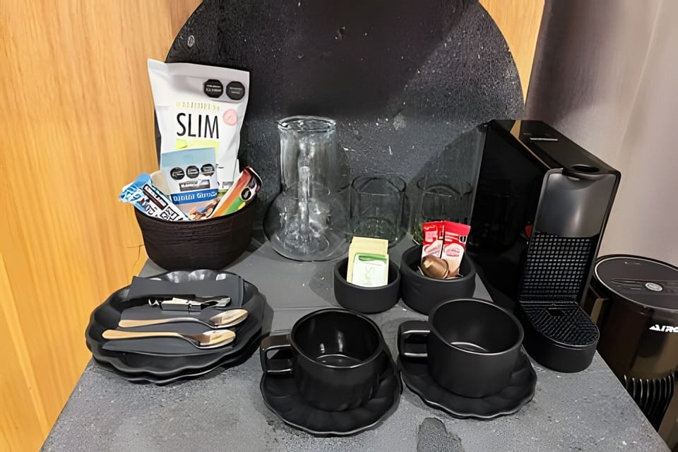 Deluxe Suite, City View | Coffee and/or coffee maker