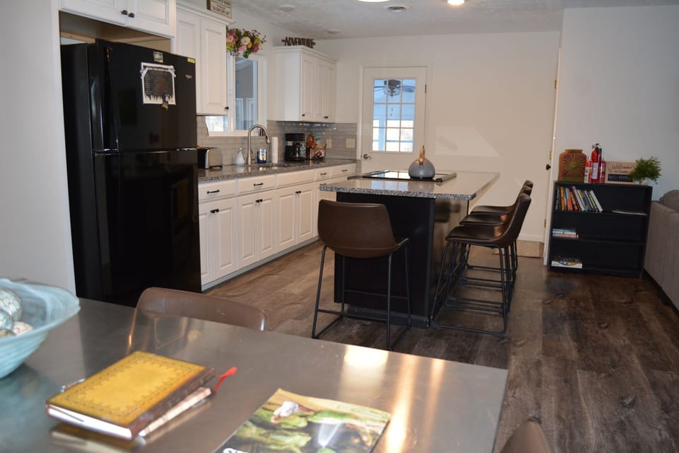 Fully stocked kitchen with dinning room seating