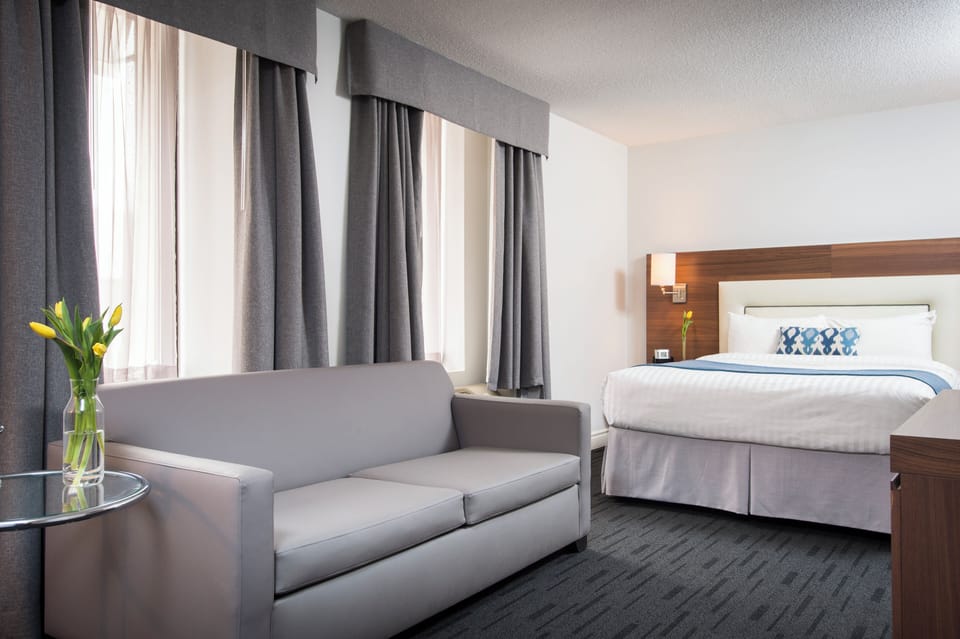 1 Queen bed, carpet | Desk, blackout drapes, soundproofing, iron/ironing board