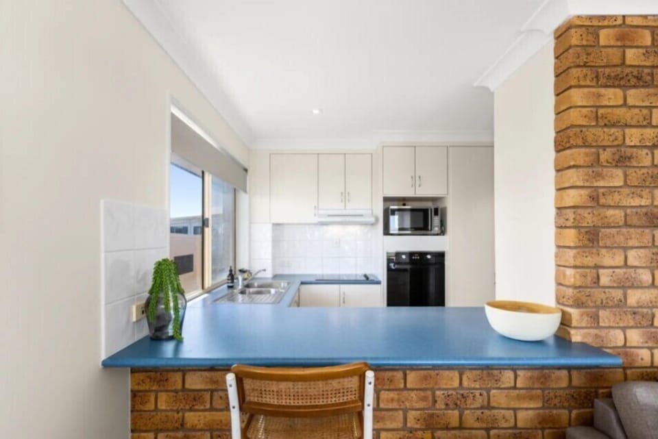 Kitchen countertop with seating for a casual meal.