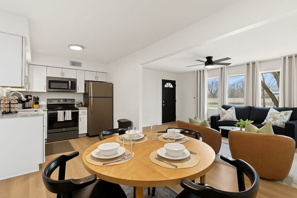 Open-concept layout connecting kitchen, dining, and living areas for effortless entertaining.