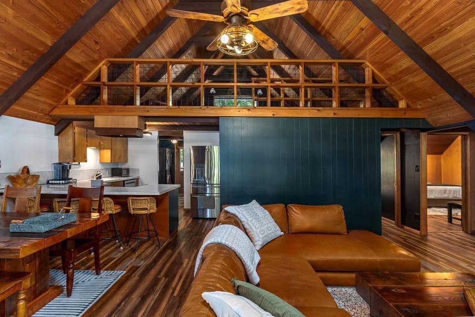 Living area looking toward kitchen and loft