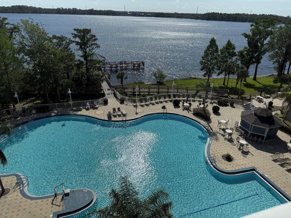 View from Balcony overlooking pool and lake