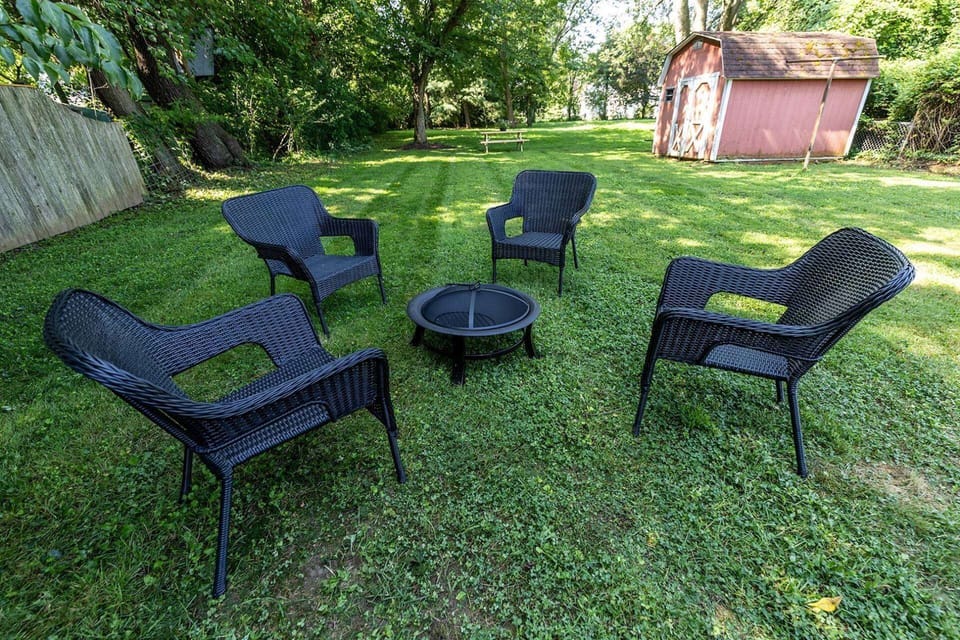 Bring the family out to the massive private backyard, equipped with a picnic table and fire pit.