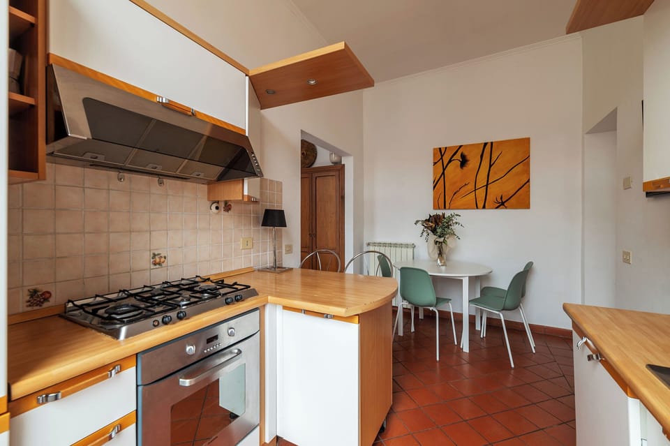 Apartment, 1 King Bed, Balcony | Private kitchen | Dining tables