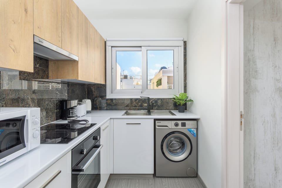 Apartment, City View | Private kitchen | Espresso maker, coffee/tea maker, full-size fridge, microwave