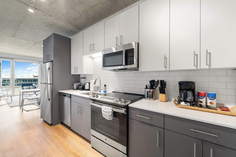 Stocked kitchen with utensils and dinerware