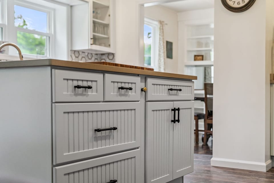It's all in the details. Charming beadboard cabinetry and a spacious island built for effortless prep. 