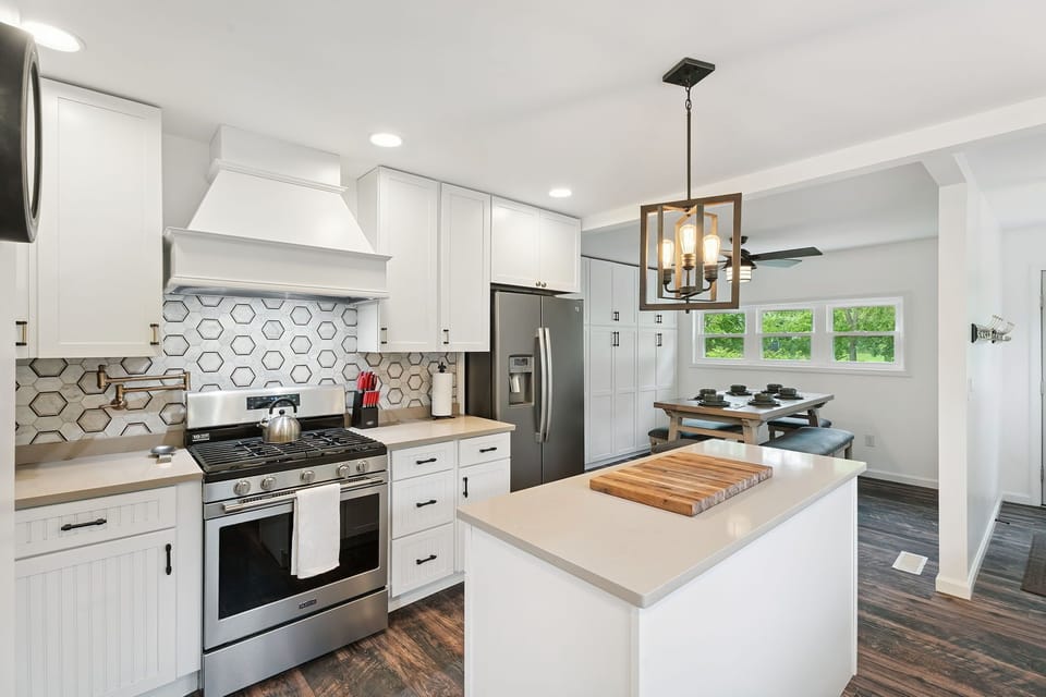 Cook with ease in this fully stocked kitchen, complete with stainless-steel appliances and a spacious island for prep or gathering. 