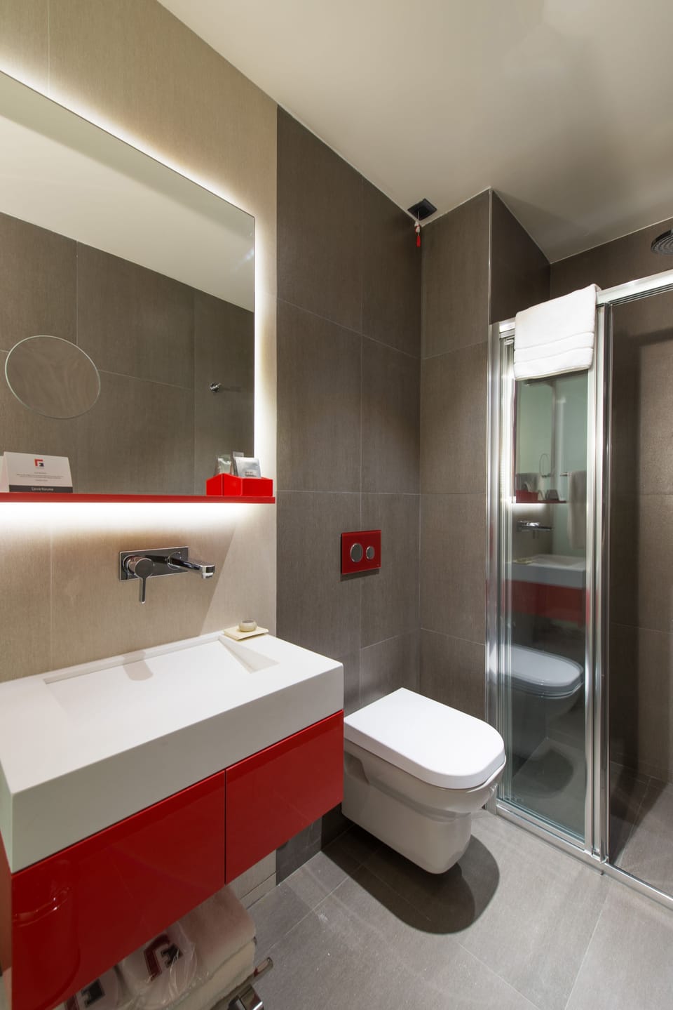 Designer toiletries, hair dryer, slippers, bidet