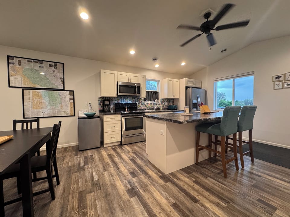 Kitchen and island, mini fridge.