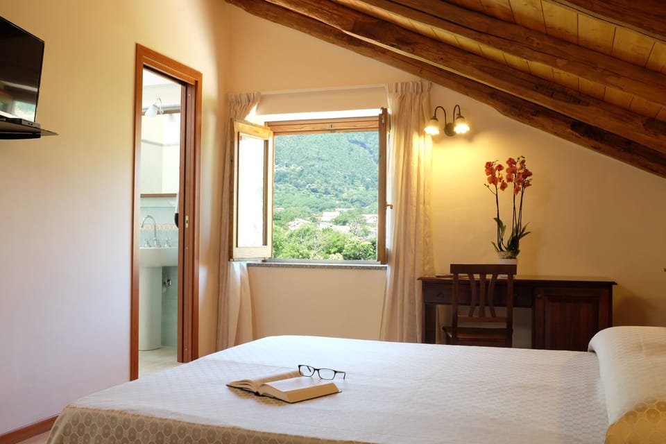 Double Room | Desk, blackout drapes, cribs/infant beds, rollaway beds