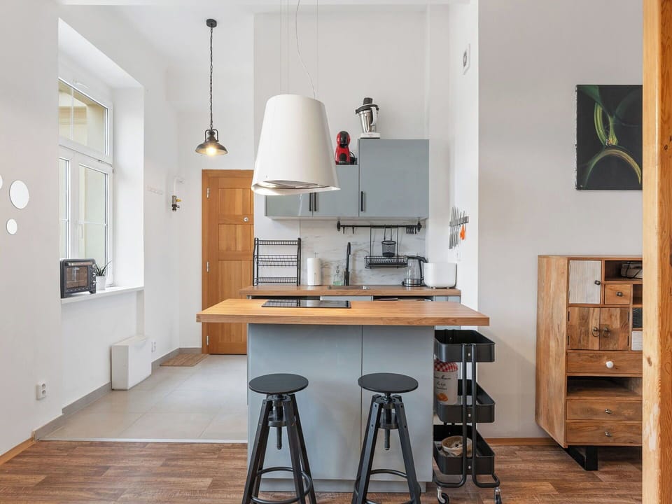 Furniture, Interior Design, Flooring, Kitchen, Floor, Light Fixture, Wood, Countertop, Ceiling, Kitchen Appliance